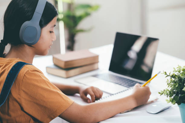 istock Happy asian girl learning online at home 1224538596