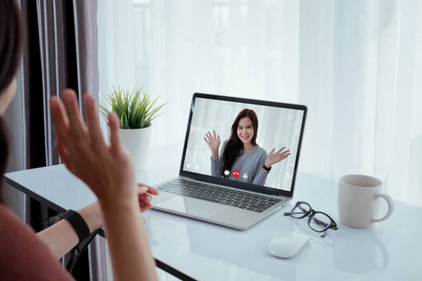 istock Asian women friend video conference user interface on laptop online remotely working from home social distancing discuss business with internet video call technology quarantine self isolation. 1224538749