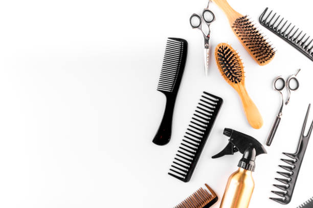 istock Hairdressing instruments. Combs, scissors and spray on white desk from above frame space for text 1224539356