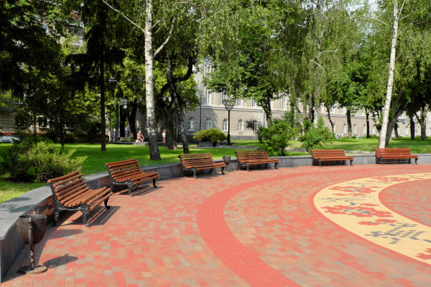 istock Benches stand in a semicircle in a city park. 1224539461