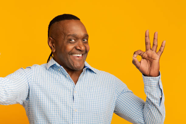istock Happy middle aged african man making selfie and showing OK 1224540778