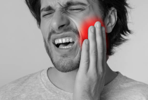 istock Tooth pain and dentistry concept. Man with painful expression 1224541242