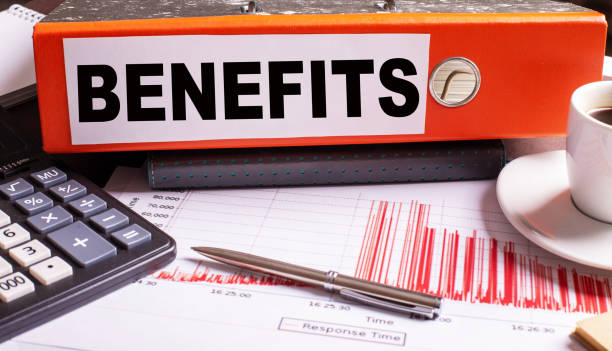 istock The word BENEFITS written on a paper folder next to a calculator and pen 1224541482