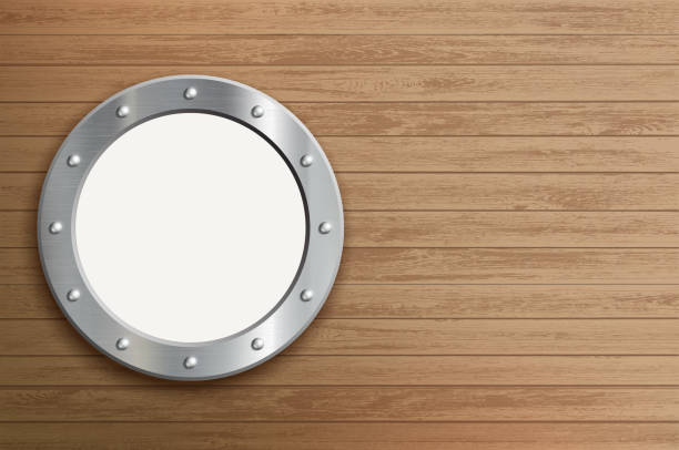 istock Round metal window. Porthole on a wooden wall. 1224541645