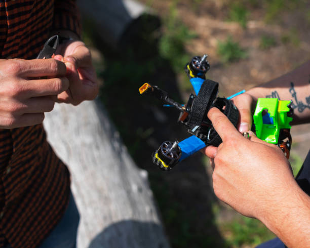 istock racing quadrocopter drone in human hands 1224542994