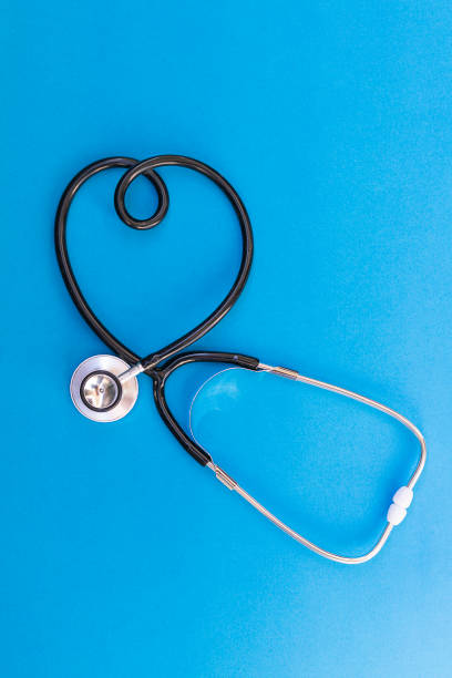 istock Stethoscope in the shape of heart on blue background 1224544045