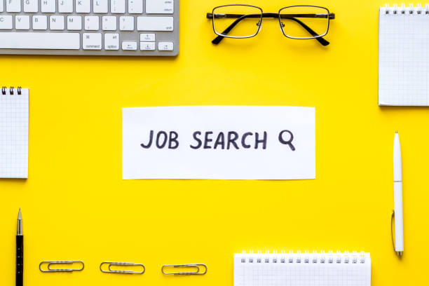 istock Job search. Flat lay, yellow office desk top-down 1224544584