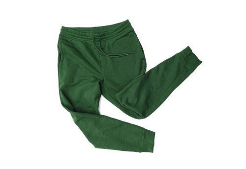 Pantalones deportivos verdes de primer plano, pantalones de chándal, jogging para hombres aislados sobre fondo blanco photo
