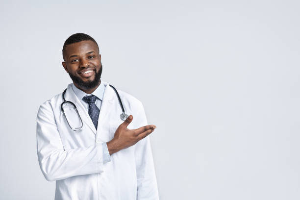 Happy african therapist pointing at empty space