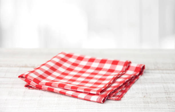 istock Red checkered cotton napkin on a wooden table 1224545955