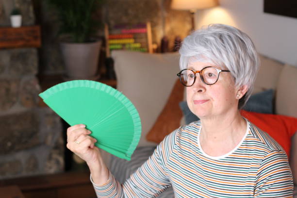 istock Uncomfortable senior woman during heatwave 1224548741