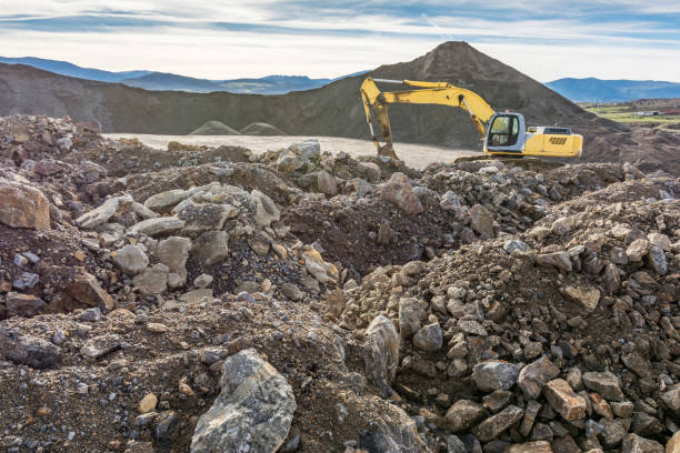 istock Machine moving rock into a quarry to transform into gravel 1224548744
