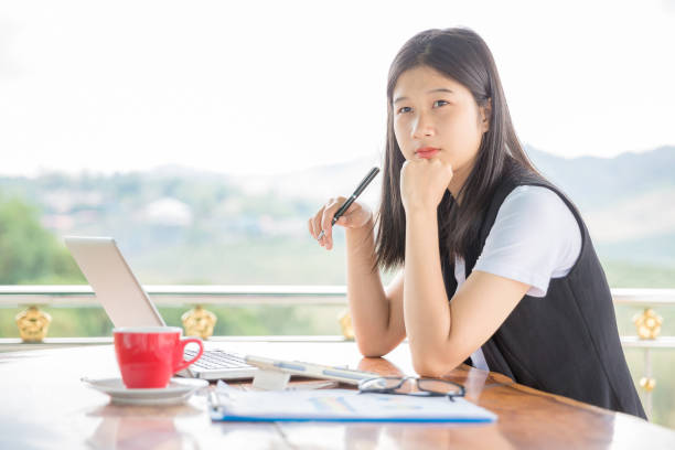 istock Beautiful young woman working on laptop computer 1224549730
