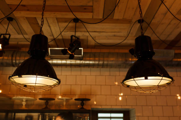istock Stylish lighting lamps over a bar counter in a loft hookah bar 1224551328