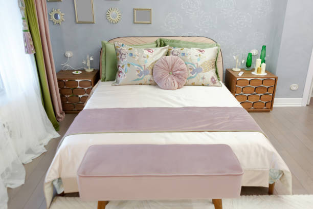 istock Large double bed in the room. Bedroom interior. 1224551452