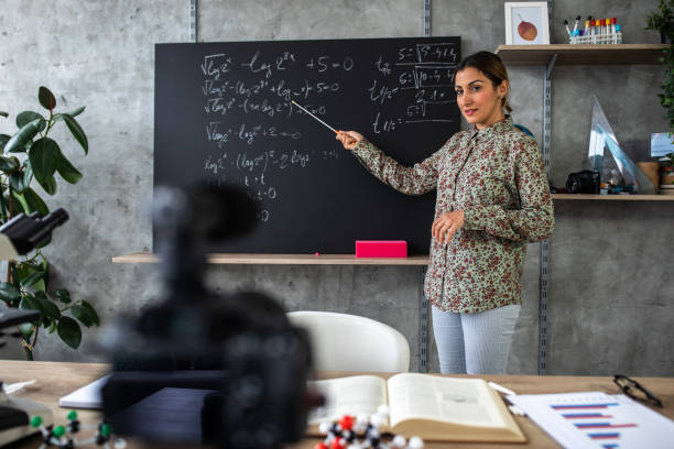 istock Math teacher schooling kids online from home classroom during coronavirus  pandemic 1224552002