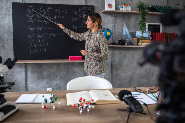 istock Math teacher schooling kids online from home classroom during coronavirus  pandemic 1224552844