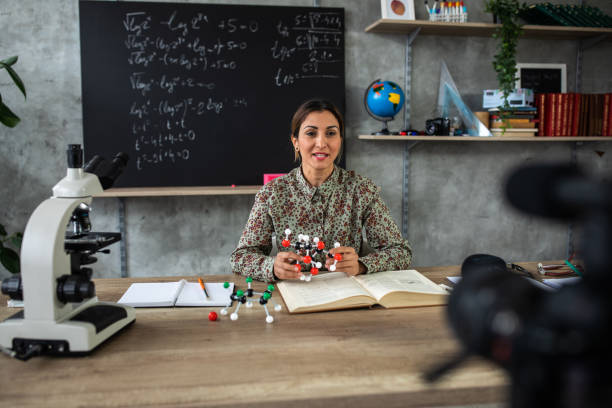 istock Teacher recording chemistry lesson during coronavirus pandemic 1224553059