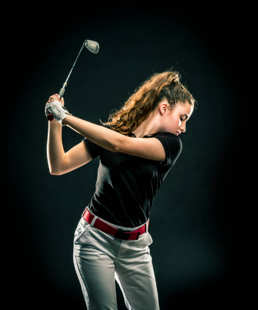 ゴルフをしている女の子のクローズアップ - children only healthy lifestyle vertical close up ストックフォトと画像