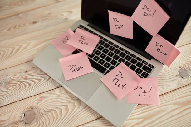 istock Image of laptop full of sticky notes reminders on screen. Work overload concept image. Coworking or working at home concept image. 1224555116