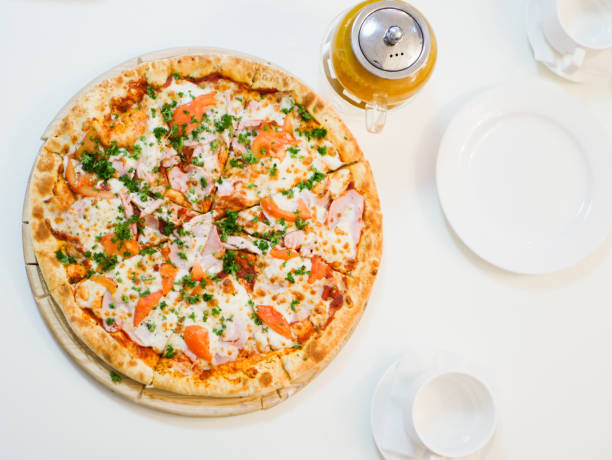 istock large view of pizza with bacon tomatoes and herbs 1224555334