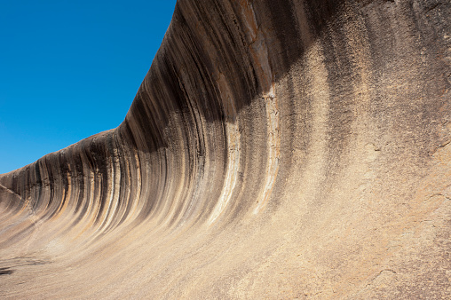 Wave Rock in Western Australia is a natural rock formation caused by wind erosion.