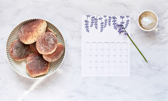 Flat lay composition with calendar and coffee