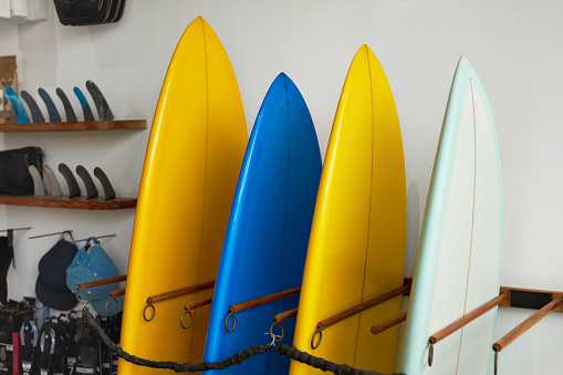 Surf Shop. Set Of Surfboards Standing In Stack At Rental Place On Beach. Water Sport Equipment, Active Lifestyle At Tropical Ocean.