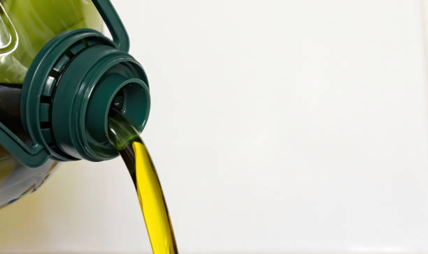 istock oil bottle pouring olive oil 1224558317