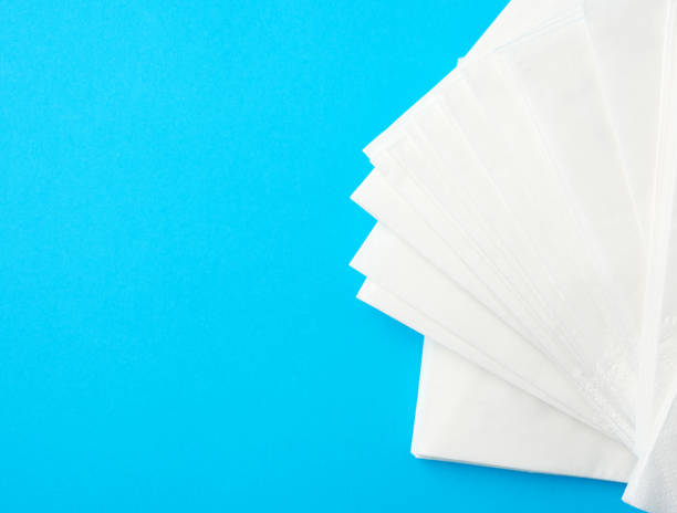 istock stack of white paper napkins on a blue background 1224558435
