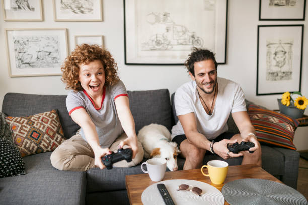 istock Young couple playing video games 1224558563