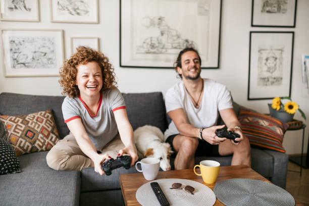 istock Young couple playing video games 1224558737