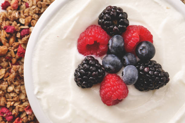 istock Composition of a typical genuine breakfast made with yogurt, blueberries, raspberries, blackberries, muesli 1224562062