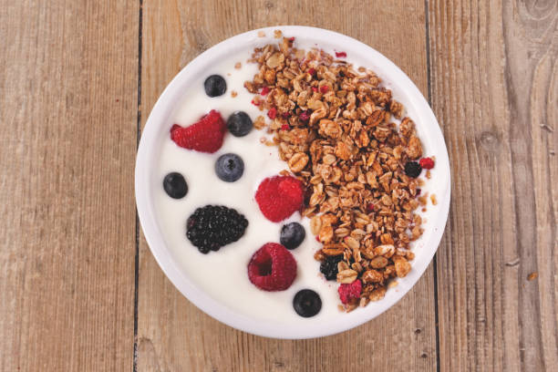 istock Composition of a typical genuine breakfast made with yogurt, blueberries, raspberries, blackberries, muesli 1224562354