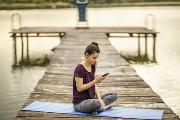 istock Young sporty attractive woman using phone 1224564039