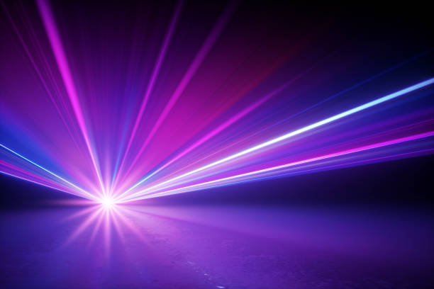istock 3d render, stage lighting, shining star rays with lens flare effect, glowing neon light, over black background. Abstract image of disco lights 1224564327
