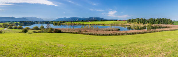 istock panoramic scene in Bavaria with lake and mountain range 1224566207