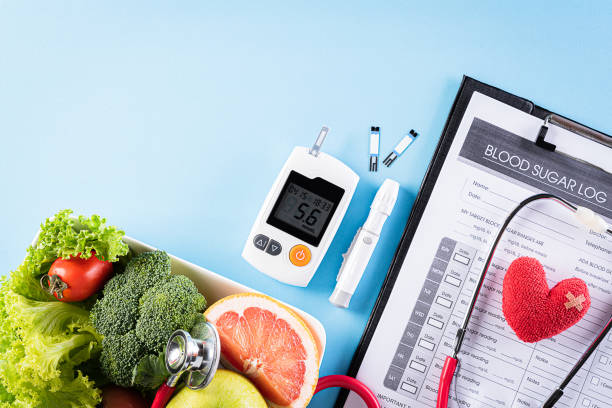 world diabetes day and healthcare concept. patient's blood sugar control, diabetic measurement, and healthy food eating nutrition with red heart on blue background. - superfood food healthy eating healthy lifestyle imagens e fotografias de stock