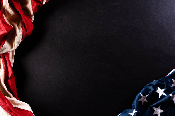 istock Happy Memorial Day. American flags  against a black  background. May 25. 1224566655