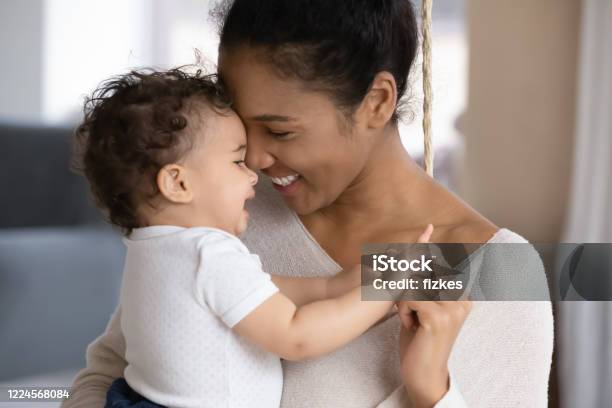Loving Biracial Mom Hug Cute Little Baby Child Stock Photo - Download Image Now - Mother, Baby - Human Age, Child