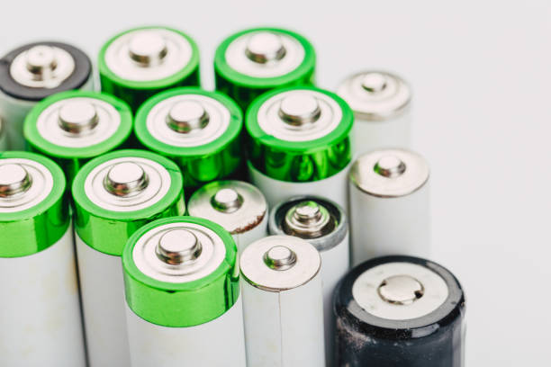 istock many new and used alkaline batteries type AA on a light background. 1224568271
