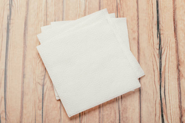 istock white paper napkin or tissue on the wooden table background. 1224568744