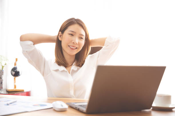 istock Young Chinese ethnicity woman using laptop browsing, working, meeting or online learning at home 1224569698