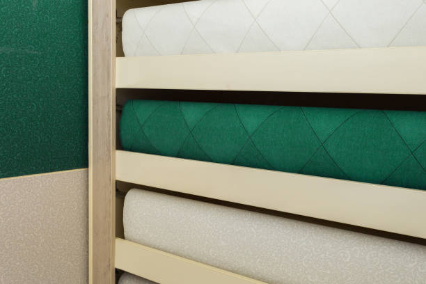 istock Shelving in the store. Fashionable multi-colored with a modern design rolls. Luxury wallpapers for interiors. 1224570073