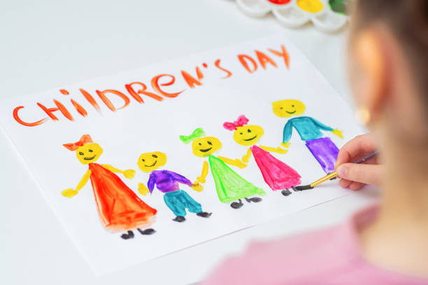 istock Child is drawing Happy Children's Day. 1224570407