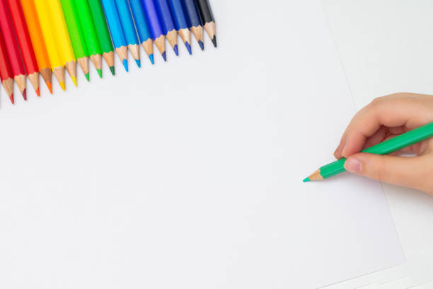 istock Kid is drawing on white blank paper. 1224570547