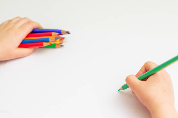 istock Child is drawing by colored pencils. 1224570684