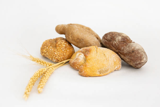 istock Homemade different breads and ears of wheat 1224571916
