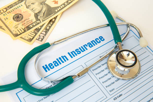Health insurance with insurance claim form and stethoscope. stock photo