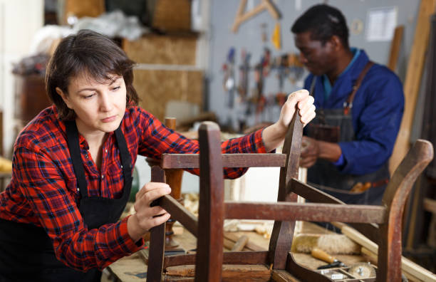 istock Restorer inspecting vintage armchair 1224574091